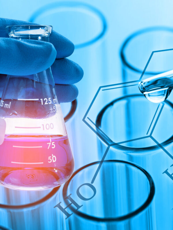 scientist hand holding laboratory flask with laboratory test tube and chemical formula background , science concept